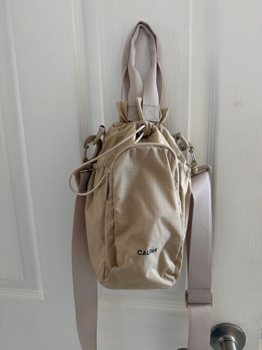 Calpak Beige Drawstring Bucket Crossbody Bag
Excellent condition